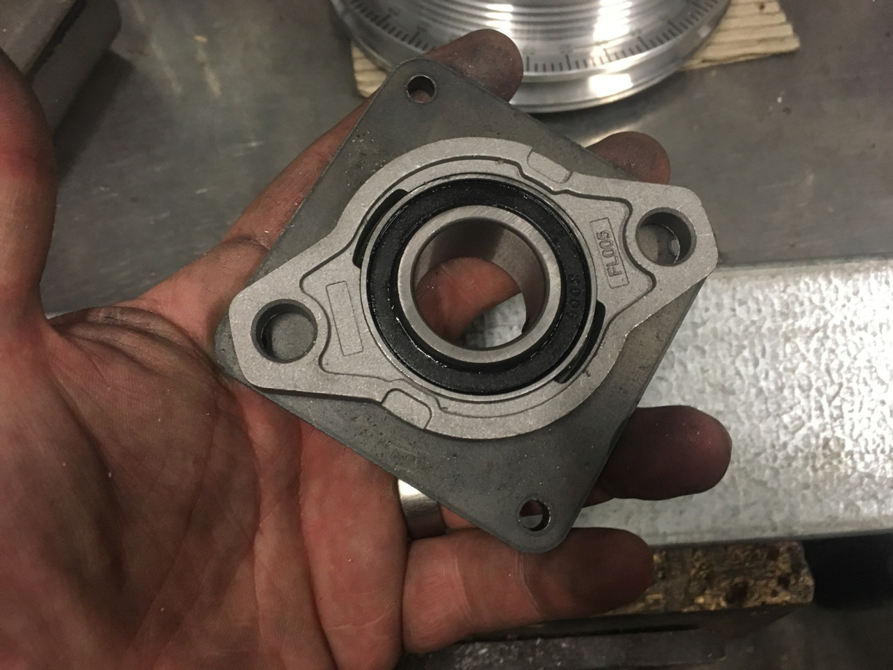Mearing in moutning plate - The bearing sits inside of the mounting plate