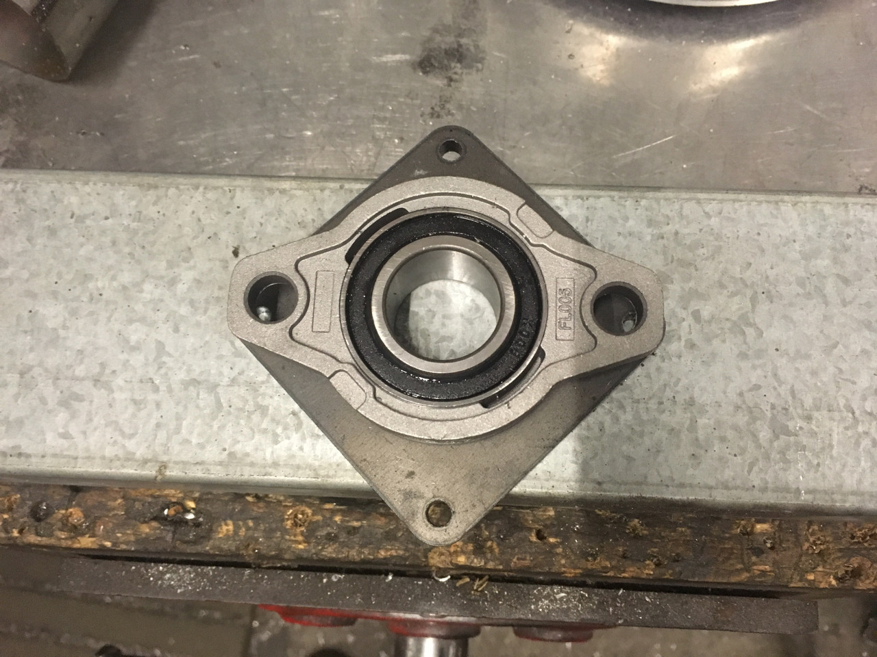 Bearing in position - The mounting plate will be welded and trimmed to it the chassis rails. The plate provides the support for the bearing, otherwise all of the weight is on the two mounting bolts and a tiny bit of alloy on the bearing ears
